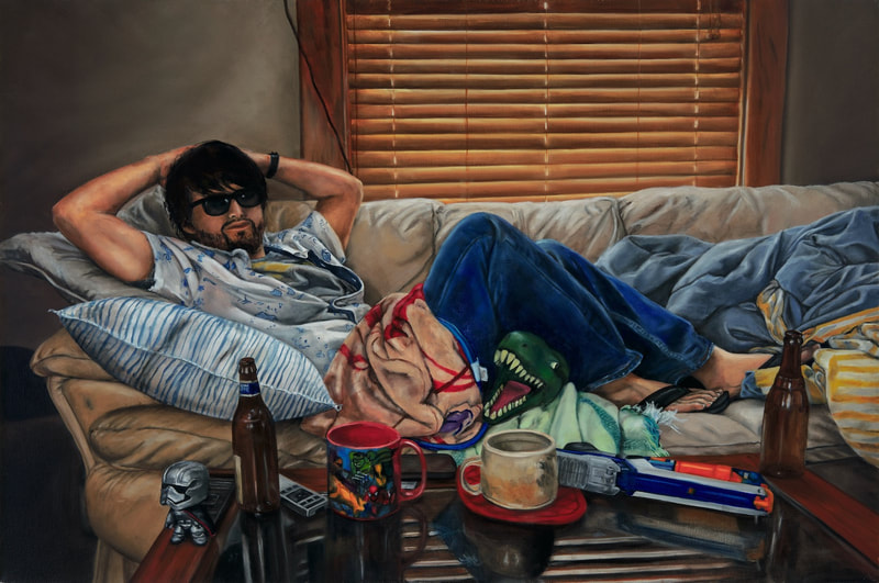 L’Brodalisque features a languid man in sunglasses and blue jeans lounging on a sofa with both hands behind his head. The coffee table in front of him displays beer bottles, coffee cups, and a Nerf gun. 